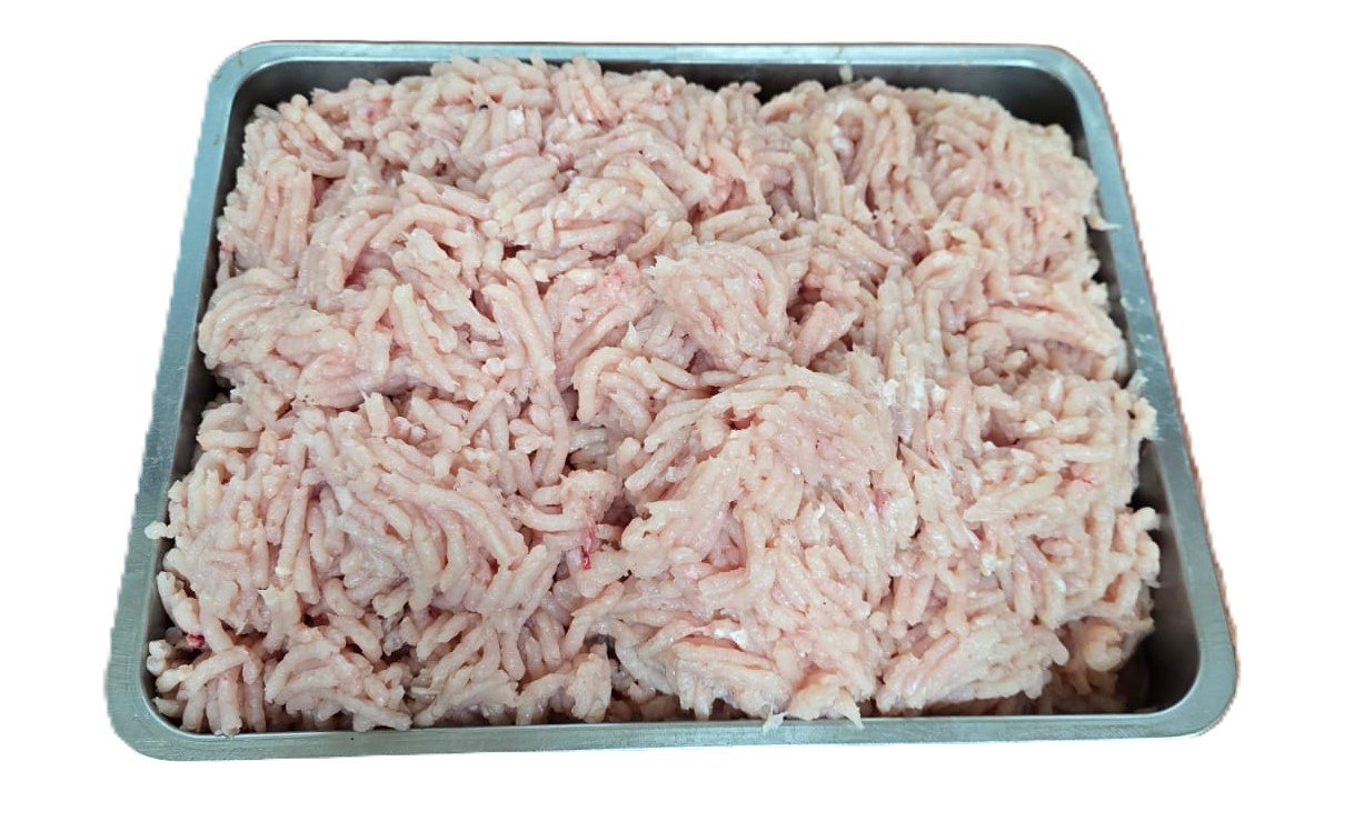 Fresh boneless chicken breasts in a butcher's tray