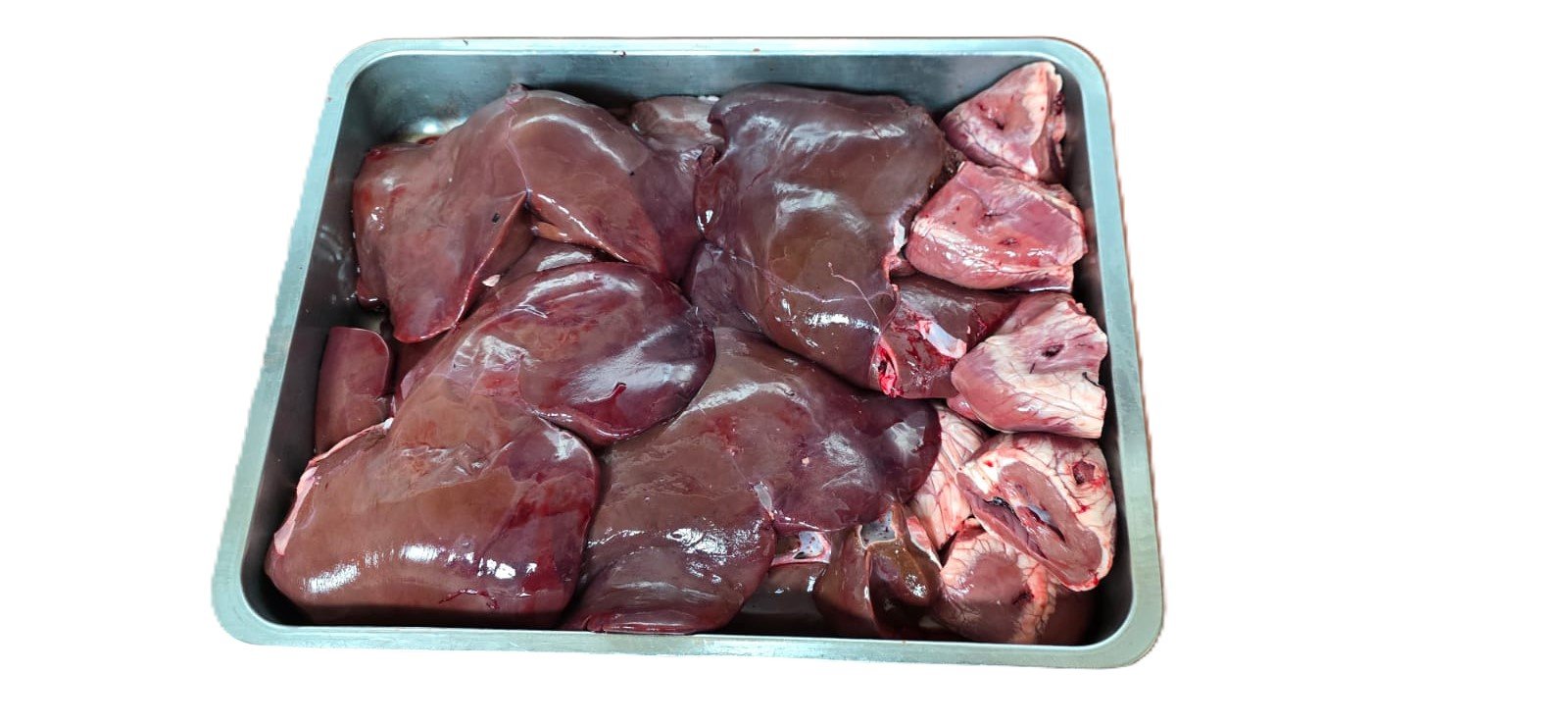 Fresh lamb curry pieces in a butcher's tray